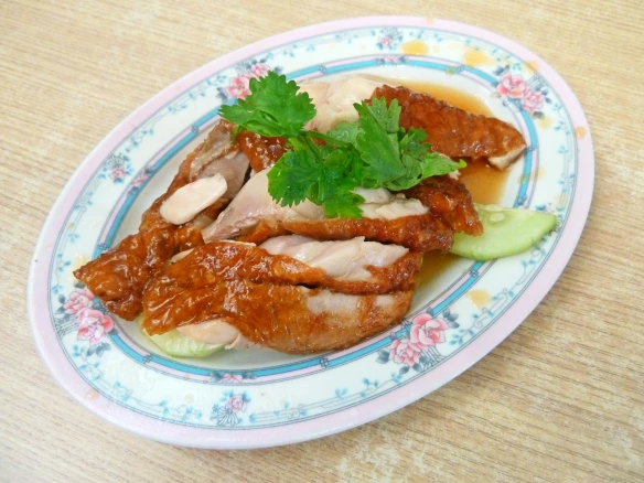For Singaporeans, the chicken rice always comes first. Here's Yeo Keng Nam's roasted varietal. © Desiree Koh